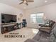 Comfortable primary bedroom with large windows, a ceiling fan, and neutral carpet at 426 Kenwood Vw, Indian Trail, NC 28079