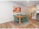 Comfortable dining room with wood table, seating for six, and colorful rug on hardwood floors at 426 Kenwood Vw, Indian Trail, NC 28079
