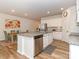 Bright kitchen featuring granite countertops, stainless steel appliances, and a dining area at 426 Kenwood Vw, Indian Trail, NC 28079