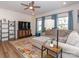 Spacious living room with a comfortable sectional sofa, television, and contemporary decor at 426 Kenwood Vw, Indian Trail, NC 28079