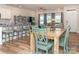 Open-concept living area with bar seating, dining table, and cozy seating in living room at 426 Kenwood Vw, Indian Trail, NC 28079