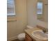 Bright bathroom with a single vanity and a large mirror at 4612 Waterbell Ln, Waxhaw, NC 28173