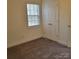 Cozy bedroom featuring neutral carpet, natural light and a double door closet at 4612 Waterbell Ln, Waxhaw, NC 28173