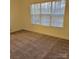 This sunny bedroom has neutral paint, carpet and a large picture window at 4612 Waterbell Ln, Waxhaw, NC 28173