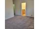 Bedroom with neutral paint and carpet as well as view into the bathroom at 4612 Waterbell Ln, Waxhaw, NC 28173