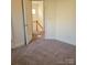 A carpeted bedroom features neutral paint, trim and an open doorway at 4612 Waterbell Ln, Waxhaw, NC 28173