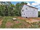 New home construction showing back and side of the property with wooded area at 5005 County Home Rd, Conover, NC 28613