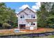 New two-story home featuring protective wrap; landscaping incomplete, showing lot and job signage at 5005 County Home Rd, Conover, NC 28613