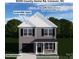 Charming two-story home with Nantucket siding, iron ore doors, and aspen white accents set against lush green trees at 5005 County Home Rd, Conover, NC 28613