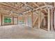 Unfinished living room showing wall and ceiling construction with stairs to upper level at 5005 County Home Rd, Conover, NC 28613