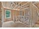 Unfinished upper level showing wall and ceiling construction and stair access at 5005 County Home Rd, Conover, NC 28613