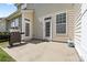 Back patio area with a grill and double doors leading into the home at 5959 Pale Moss Ln, Charlotte, NC 28269