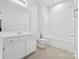 Clean bathroom with tub/shower combo, and a large vanity with sink at 5959 Pale Moss Ln, Charlotte, NC 28269