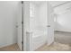 Bathroom featuring a tub, neutral flooring, and a bright interior at 5959 Pale Moss Ln, Charlotte, NC 28269