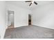 Large bedroom with carpet flooring and ensuite bathroom and closet at 5959 Pale Moss Ln, Charlotte, NC 28269