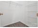 Walk in closet with shelving, carpet, and white interior at 5959 Pale Moss Ln, Charlotte, NC 28269