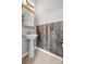 Stylish powder room with pedestal sink and unique wall accent at 5959 Pale Moss Ln, Charlotte, NC 28269