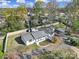 Aerial view of a single Gathering home with a large backyard, mature trees and a detached garage at 6823 City View Dr, Charlotte, NC 28212