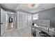 This bedroom offers ample natural light and neutral tones and features an office setup and closet at 6823 City View Dr, Charlotte, NC 28212