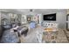 Relax in this bright living room with modern furnishings, neutral tones, and an open layout at 6823 City View Dr, Charlotte, NC 28212