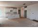 Bright kitchen with white cabinets and an island, offering a clean slate for customization and culinary adventures at 713 Inwood Hill Dr # 96, Gastonia, NC 28056