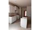 White kitchen cabinets with a kitchen island, offering potential buyers the chance to customize to their liking at 713 Inwood Hill Dr # 96, Gastonia, NC 28056