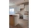 White kitchen cabinets, including a central island, in a space ready for final touches and personalization at 713 Inwood Hill Dr # 96, Gastonia, NC 28056