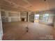 Expansive living room under construction, featuring a fireplace, large windows, and ample natural light at 713 Inwood Hill Dr # 96, Gastonia, NC 28056