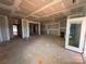 Bright, spacious living room under construction with a door leading to outdoor spaces at 713 Inwood Hill Dr # 96, Gastonia, NC 28056