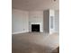 Living room featuring a fireplace with white mantle and neutral paint, ready for customization at 713 Inwood Hill Dr # 96, Gastonia, NC 28056
