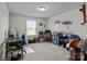 Spacious bedroom with multiple desks, shelving, and natural light from a window at 7172 Indigo Way, Denver, NC 28037