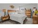 Bright bedroom featuring a light wood bedframe, and matching nightstand and dresser at 7172 Indigo Way, Denver, NC 28037