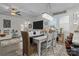 Open-concept living, dining, and kitchen area featuring modern lighting and neutral decor at 7172 Indigo Way, Denver, NC 28037