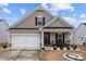 Charming single-Gathering home with a well-manicured lawn, inviting front porch and attached two car garage at 7172 Indigo Way, Denver, NC 28037