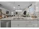Open-concept kitchen and living space with modern appliances, countertop seating, and neutral decor at 7172 Indigo Way, Denver, NC 28037
