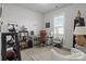 Bright home office with a large window, desk, and comfortable seating area at 7172 Indigo Way, Denver, NC 28037