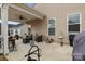 Covered patio featuring comfortable seating, a ceiling fan, and outdoor decor at 7172 Indigo Way, Denver, NC 28037