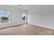 Bright room with two windows offering outdoor views; a blank canvas to create your perfect personal space at 8455 W Nc 152 Hwy, Mooresville, NC 28115