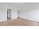 Bright room with fresh white walls; a door leads to a closet or bathroom, ready for your personal touch at 8455 W Nc 152 Hwy, Mooresville, NC 28115