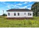Exterior shot of a charming, one-story home with white siding and a well-maintained yard at 8455 W Nc 152 Hwy, Mooresville, NC 28115