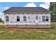 Newly constructed home showcasing brick base, fresh windows, and building wrap, ready for personalization at 8455 W Nc 152 Hwy, Mooresville, NC 28115