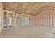 Unfinished room with exposed framing, insulation, and utilities, ready for customization at 8455 W Nc 152 Hwy, Mooresville, NC 28115