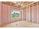 Interior of a house with exposed studs, insulation and a window showing exterior view at 8455 W Nc 152 Hwy, Mooresville, NC 28115