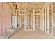 Interior framing with insulation, plumbing and electrical work in progress, offering customization potential at 8455 W Nc 152 Hwy, Mooresville, NC 28115
