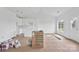 Bright, unfinished open floorplan, featuring white cabinets and a door to the outside at 8455 W Nc 152 Hwy, Mooresville, NC 28115