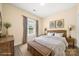 Cozy bedroom with warm lighting, wood furnishings, and decor at 8617 Coralbell Ln, Charlotte, NC 28213