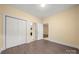 Large closet, laundry area, and open doorway to an additional room at 8617 Coralbell Ln, Charlotte, NC 28213