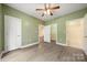 Bedroom view showcasing closet, ensuite, and access to additional room or storage space at 8617 Coralbell Ln, Charlotte, NC 28213