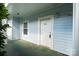 Well-lit entryway with a white door, showing the exterior of the apartment at 8617 Coralbell Ln, Charlotte, NC 28213
