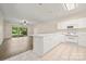 Open concept kitchen and living room space with a breakfast bar and stainless steel appliances at 8617 Coralbell Ln, Charlotte, NC 28213